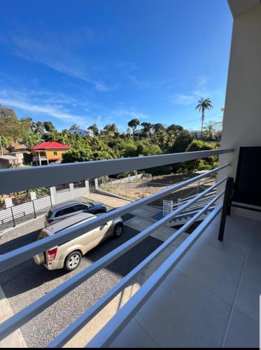 a car parked on the balcony of a building at Grey Stone Villa in Happy Hill