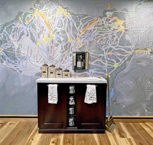 a room with a wall with a mural of a map at Gondola Chalet -New Luxury 5 Bdrm Condo @ Canyon Lodge, Steam Room in Mammoth Lakes