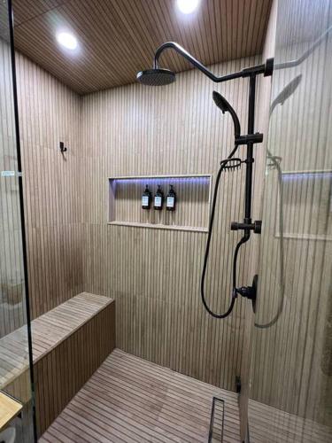 a bathroom with a shower with a glass door at Gondola Chalet -New Luxury 5 Bdrm Condo @ Canyon Lodge, Steam Room in Mammoth Lakes