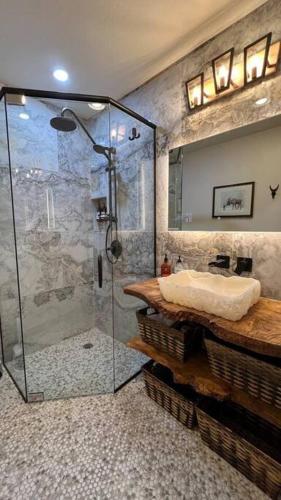 a bathroom with a shower and a sink at Gondola Chalet -New Luxury 5 Bdrm Condo @ Canyon Lodge, Steam Room in Mammoth Lakes
