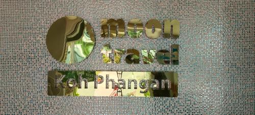 a sign that says out of control on a wall at Moon Travel Phangan in Ban Nua