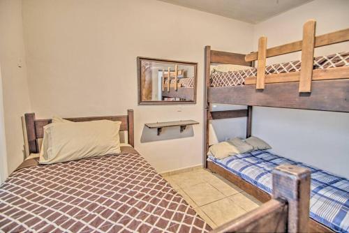 a bedroom with two bunk beds and a mirror at Perla del Mar - Large Pool and 6 blocks to Beach in Bucerías
