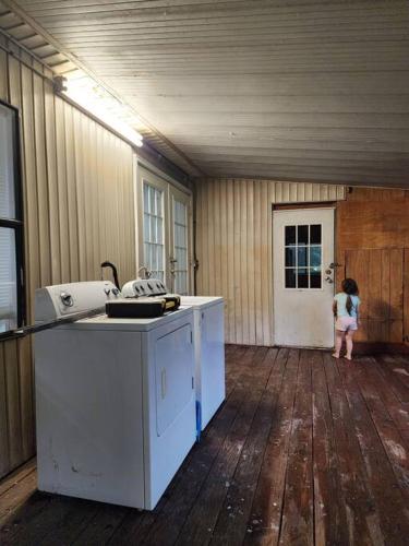 a little girl standing in an empty room at Your second home in florida in Altoona