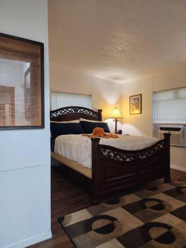 a bedroom with a bed with a dog laying on it at Your second home in florida in Altoona