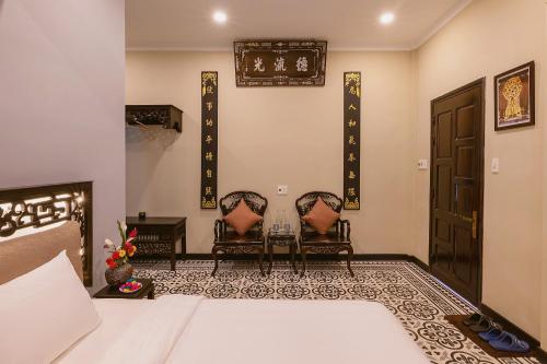 Ένα ή περισσότερα κρεβάτια σε δωμάτιο στο HueNam Residence