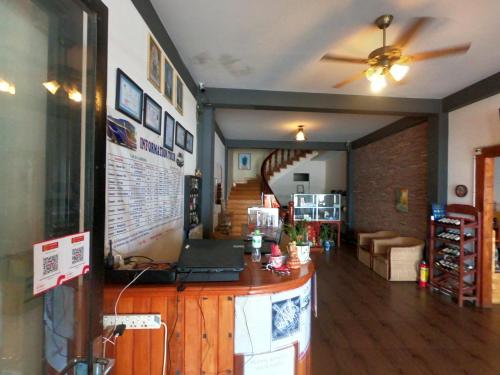 a living room with a counter with a laptop on it at Good Morning Kampot in Kampot