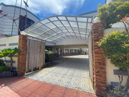 an entrance to a building with an arched entryway at Casa Marie Hotel in Daet