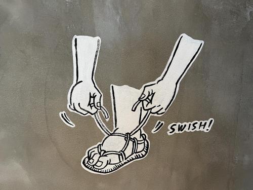 a drawing of a person with their feet in a sandal at hotel Bell・Kyoto in Kyoto