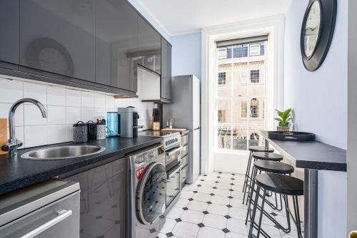 a kitchen with a sink and a dishwasher at BRAND NEW LISTING Beautiful 2 bedroom apartment in Bath