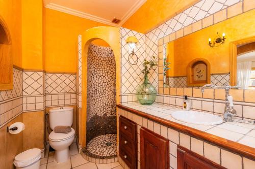 a bathroom with a toilet and a sink at Sa Fonteta Cala Morlanda in S'Illot