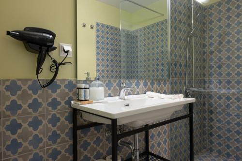 a bathroom with a sink and a mirror at ATHENS STORIES in Athens