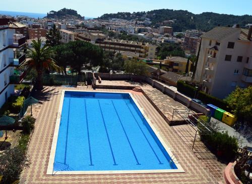 a large swimming pool on top of a building at Apartments Soleil Tossa 5 in Tossa de Mar
