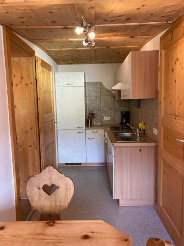 a small kitchen with a sink and a counter top at Öfnerhof in Leutasch