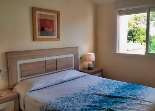 Säng eller sängar i ett rum på Isla de Altea