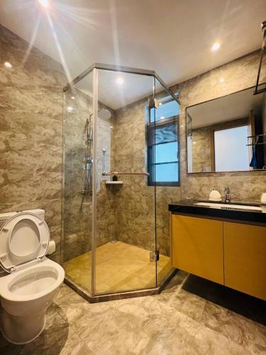 a bathroom with a shower and a toilet and a sink at R&F PRINCESS COVE at ANJU in Johor Bahru