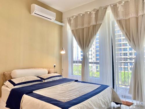 a bedroom with a bed and a large window at 1-2pax CozyStudio,Central Park Jb townCIQ, Free Netflix,Wi-Fi,Youtube in Johor Bahru