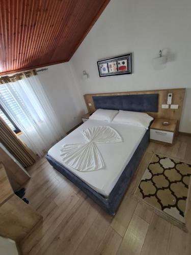Ένα ή περισσότερα κρεβάτια σε δωμάτιο στο Hotel Darda
