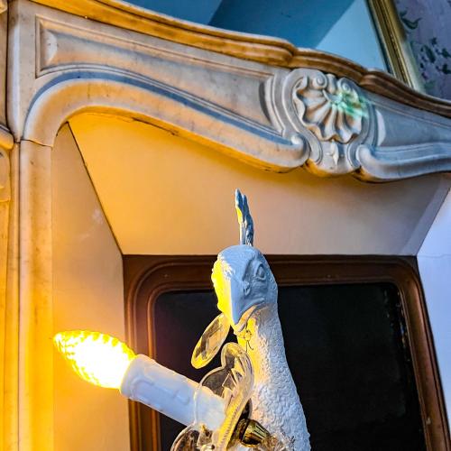 a statue of a bird on a window at La Demeure d'Élodie in Épernay