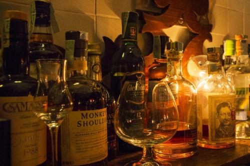 a group of bottles and glasses of wine on a counter at Locanda del Bagatto in Milazzo