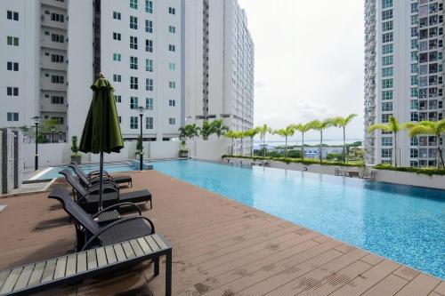 a swimming pool on the roof of a building at Straits Garden Suites Penang in Jelutong