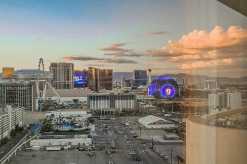 a view of a large city with a building at NO RESORT FEES-MGM Stripview-Jacuzzi-Formula 1 TRACK VIEW in Las Vegas