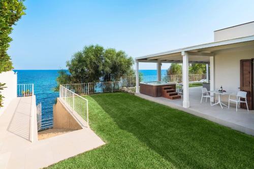 a balcony of a house with a view of the ocean at Stella Maris in Noto Marina