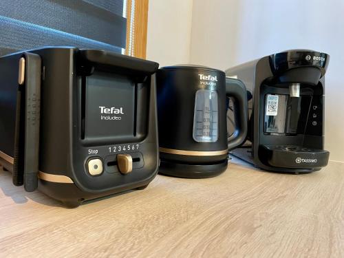 two coffins and a coffee maker sitting on a table at * Chic Business Evasion * - SOnights in Brétigny-sur-Orge