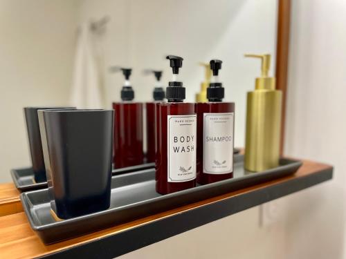 a shelf with three bottles ofmetics on it at * Chic Business Evasion * - SOnights in Brétigny-sur-Orge