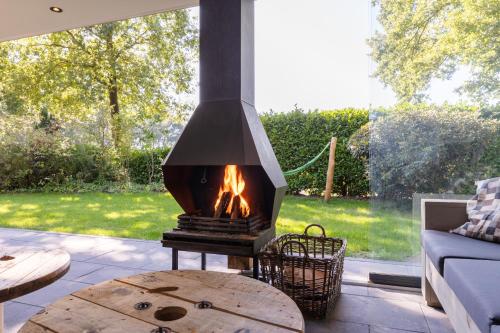 Κήπος έξω από το KempenLodge, luxe boshuis voor 8 pers, in Brabantse natuur