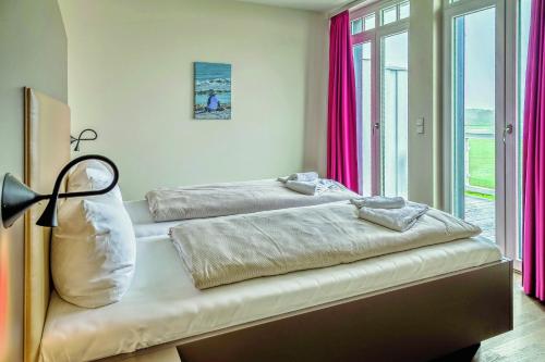 Postel nebo postele na pokoji v ubytování Resort Deichgraf Resort Deichgraf 27-19