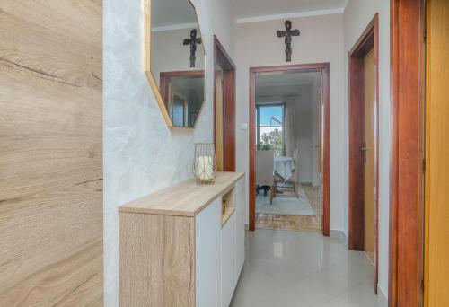 a kitchen with a counter and a cross on the wall at Marina Porat in Porat