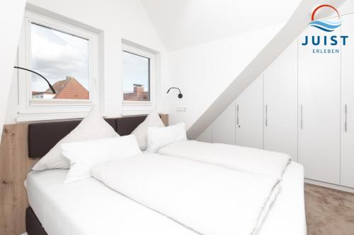 Postel nebo postele na pokoji v ubytování Haus Treibgut 236 - Wohnung 6
