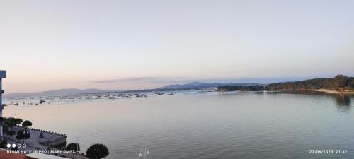 a large body of water with boats in it at Hotel Brisa del Mar in O Grove