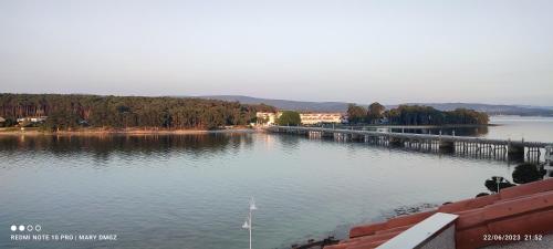 a large body of water with a dock at Hotel Brisa del Mar in O Grove