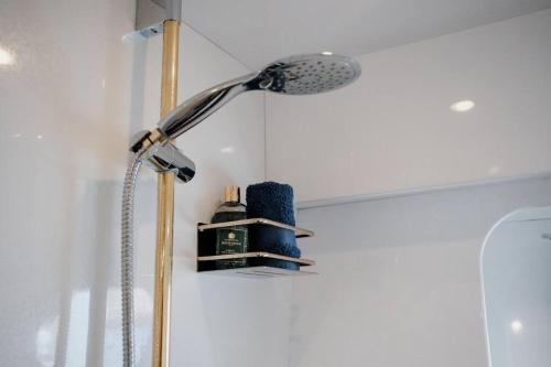 a shower with a shower head in a bathroom at Beyond82: Luxury Yacht in Puglia in Brindisi