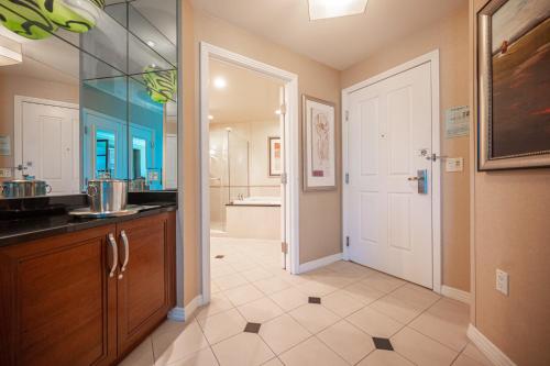 a bathroom with a sink and a bath tub at NO RESORT FEES-MGM StripView Adjoining Suites F1 View in Las Vegas