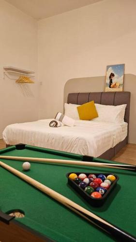 a bedroom with a pool table and a bed at Home at Indera Mahkota Kuantan Unifi 100mb+ TV BOX in Kuantan