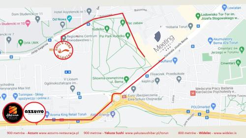 a map with a red line and a red circle at Hotel Meeting in Toruń