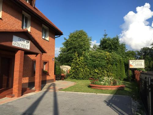 a building with a sign on the side of it at Dom Gościnny 8 km od Suntago, Deepspot in Radziejowice