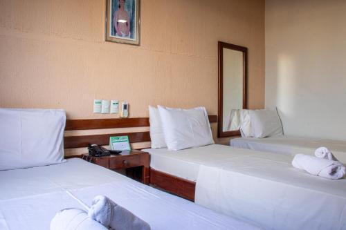 Ένα ή περισσότερα κρεβάτια σε δωμάτιο στο Inácios Hotel ltda