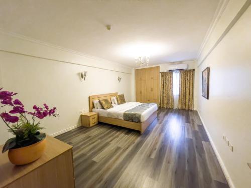 a bedroom with a bed in a room at Maroko Bayshore Suites in Lagos