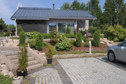 a house with a garden in front of it at Villa Graniitti in Imatra