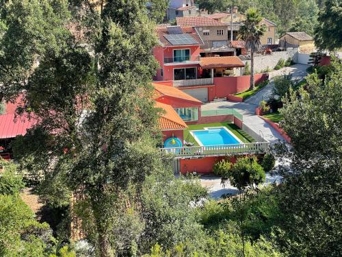 an aerial view of a house with a swimming pool at Refúgio da Póvoa in Anadia