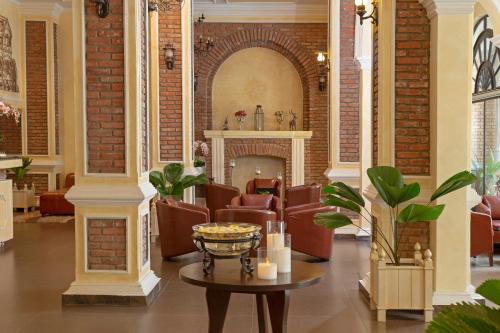 a lobby with a waiting room with chairs and a fireplace at Anik Boutique Hotel in Phnom Penh