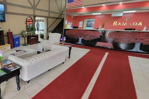 a room with a red carpet in a store at Ramada by Wyndham Mountain Home in Mountain Home
