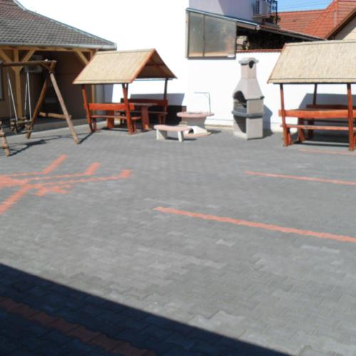 a parking lot with orange writing on the ground at Oázis Apartman in Harkány