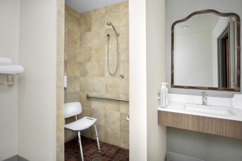 a bathroom with a sink and a shower at Hilton Garden Inn Missoula in Missoula