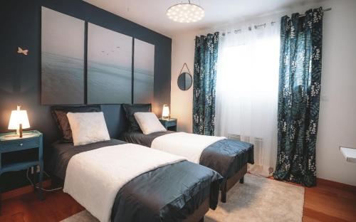 Un pat sau paturi într-o cameră la Chambre d'hôte Lonnoy