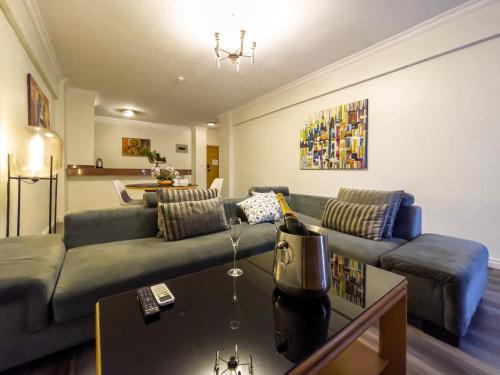 a living room with a couch and a table at Maroko Bayshore Suites in Lagos