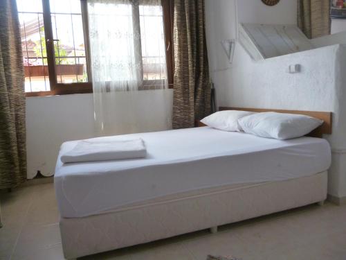 Ένα ή περισσότερα κρεβάτια σε δωμάτιο στο Frankfurt Hotel
